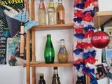 a shelf with bottles of alcohol on it in a room