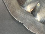 a close up of a metal object on a table