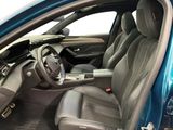 the interior of a blue car with leather seats and a steering wheel