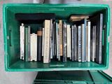 a green box filled with books on top of a table