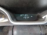 a digital clock on the dashboard of a motorcycle