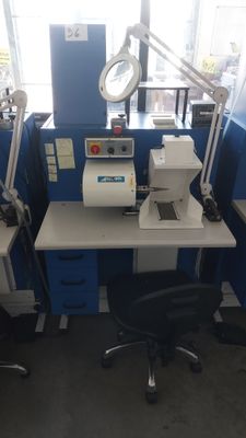 an image of a lab with a desk and a chair