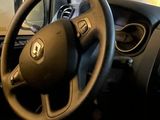dashboard of a car with a steering wheel and steering knobs