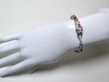 a bracelet that is on the arm of a mannequin