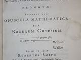 an old book that is open on a table