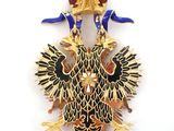 an image of a gold and enamel eagle broochle