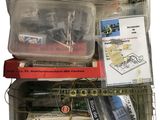 many different types of toy trains in a plastic container