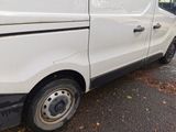 a white van that is parked on the side of the road