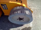 a wheel on the back of a small machine