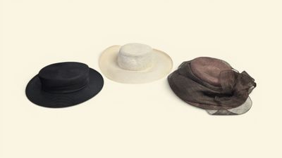 three hats are lined up on top of each other on a white surface