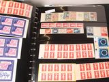 a lot of stamps in a binder on the table