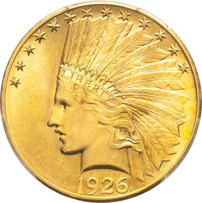 a close up of a gold coin with a headdress on it