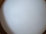 a white ball sitting inside of a box on a table