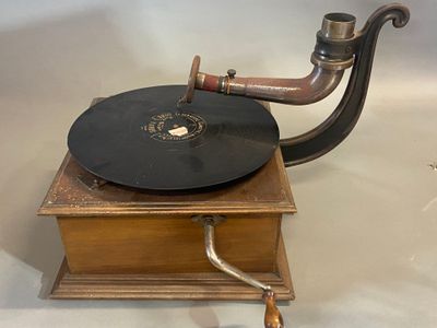 an old record player on display on a table
