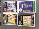 four boxes of legos on display in a store