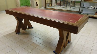 a long table with a red top in a room
