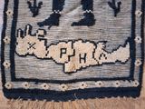 an image of a rug with a picture of a cat on it