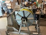 a machine that is sitting on a cart in a garage
