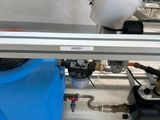 a picture of a machine that has a blue container on it