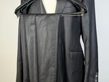 black leather jacket on a mannequin hanger on a mannequin dummy