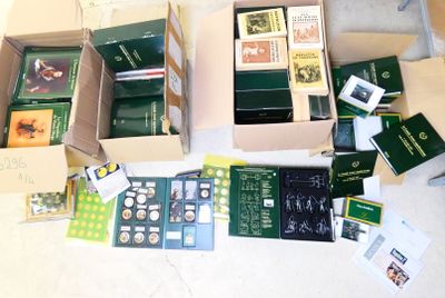 several boxes of books are sitting on a table with a white table cloth