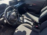 the interior of a car with a steering wheel and a dashboard