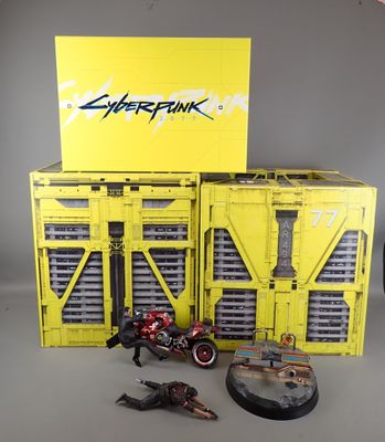 a yellow box with a motorcycle and other toys on it
