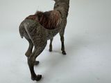 a sculpture of a deer that is standing in the snow
