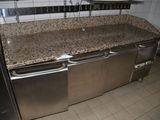 a kitchen with a stove and a sink in it