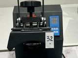 a machine that is sitting on a table with a bag