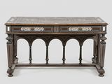 an old wooden table with two drawers and a marble top