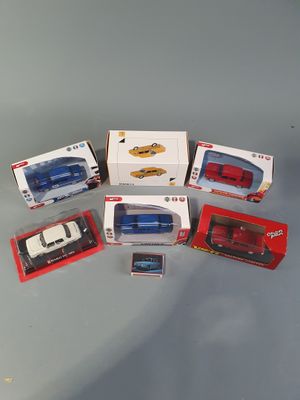 a lot of toy cars that are sitting on a table