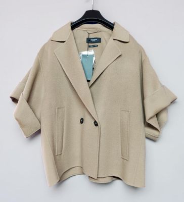 the jacket is tan and has a blue tie on the hanger