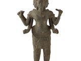 an image of a statue of a person with a bird in his hand