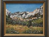 un tableau représentant une montagne avec un village en arrière-plan