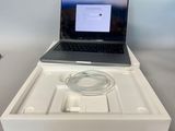 a laptop computer sitting in a white box on a table