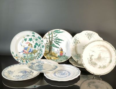 many plates that are sitting on a table