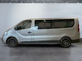 a silver van that is parked inside of a building