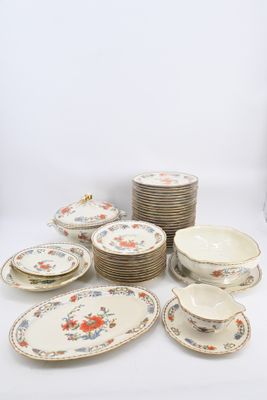 many plates and bowls that are sitting on a table