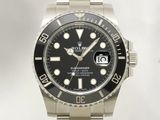 une montre Rolex avec un cadran noir et un bracelet