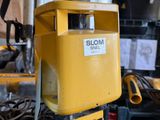 a yellow machine that is sitting in a garage