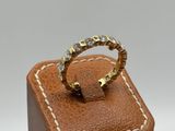 an image of a ring on top of a brown leather box
