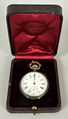 a small box with a watch inside of it