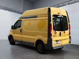 a yellow van that is parked in a room