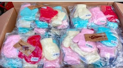 many pairs of socks in a box on a table