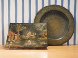 a plate with a picture on it next to a plate with a picture on it