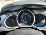 a car dashboard with a speedometer and gauges on it
