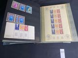 a book with stamps on it sitting on a table