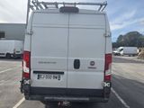 a white van that is parked in a parking lot