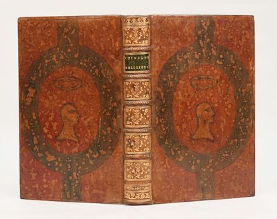an old book with a picture of a woman on the cover